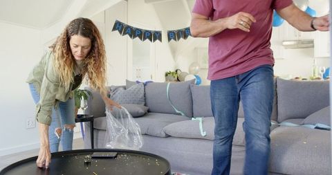 Mature Couple Preparing Home for Birthday Celebration