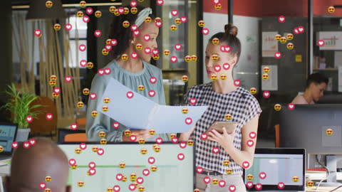 Diverse Colleagues Discussing Ideas with Social Media Graphics