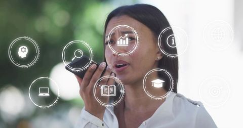 Businesswoman utilizing voice technology with floating data icons outdoors