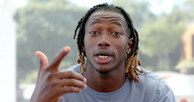 Expressive Young Black Man Gesturing While Speaking Outdoors - Download Free Stock Images Pikwizard.com