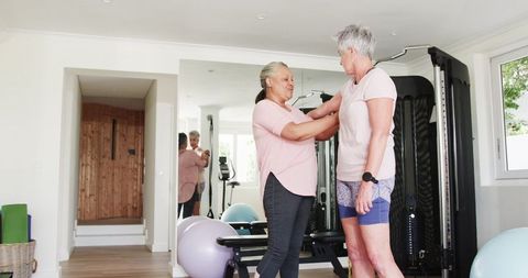 Senior Couple Embracing Fitness at Home Gym