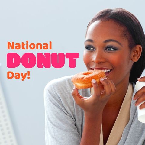 Smiling woman enjoying donut celebrating national donut day