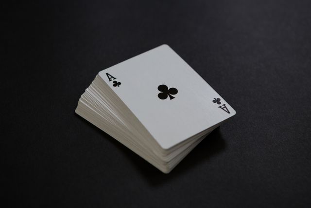 Close-up of card deck on black table