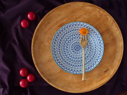 Vibrant Cherry Tomatoes on Wooden and Ceramic Serving Disk