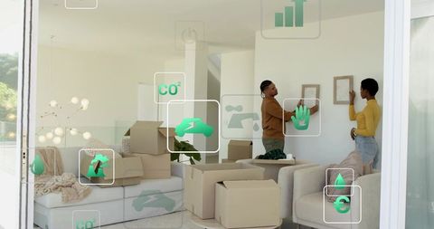 Couple unpacking and hanging frames in eco-friendly minimalist living room