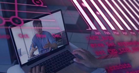 Typing on laptop while viewing remote presenter with magenta data-visualization overlays