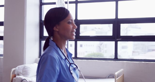 Professional Healthcare Worker Walking in Hospital Ward - Download Free Stock Images Pikwizard.com