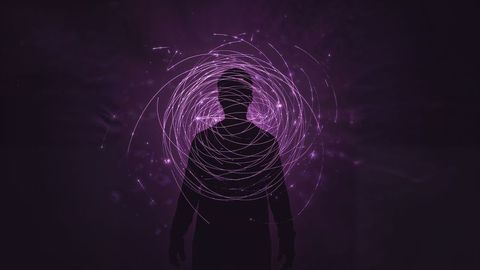 Silhouette in futuristic purple light swirl quantum energy