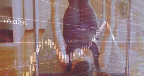Businesswoman analyzing stock market graphs with focus