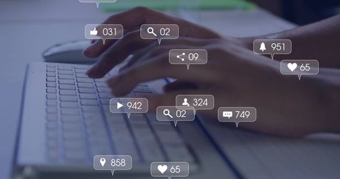 Hands Typing on Laptop with Floating Social Media Notifications, Alerts and Icons
