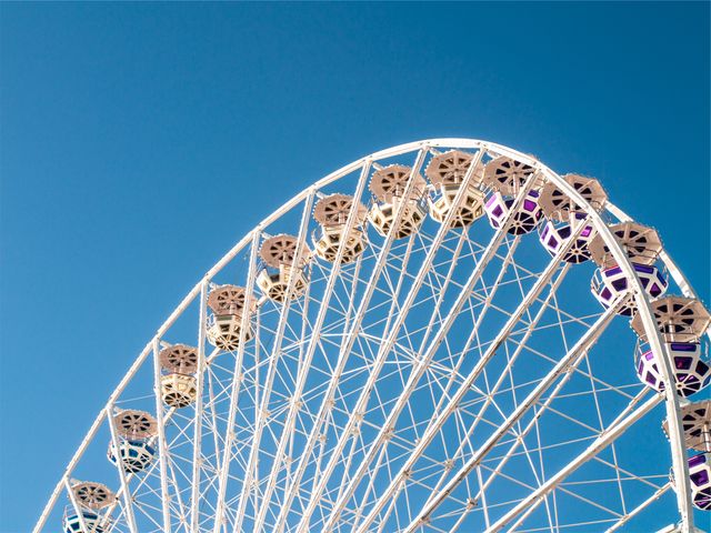 Ferris Wheel Against Clear Blue Sky at Amusement Park - Download Free Stock Photos Pikwizard.com