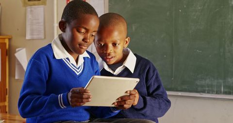 Schoolboys Engaged with Tablet for Collaborative Learning - Download Free Stock Images Pikwizard.com