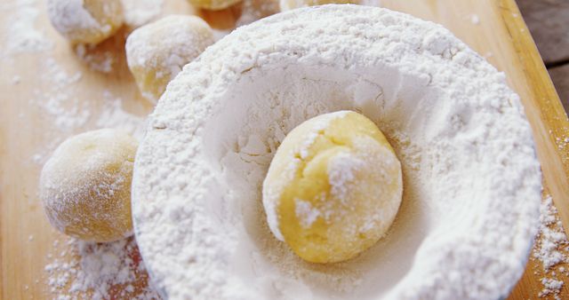 Close-up of Dough Balls Coated in Powdered Sugar on Wooden Surface - Download Free Stock Images Pikwizard.com