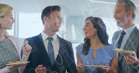 Corporate networking over appetizers laughing colleagues in business attire
