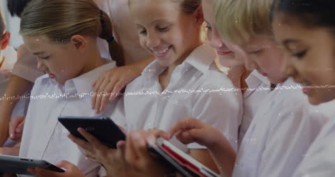 Diverse Schoolchildren Using Tablets with Digital Overlay