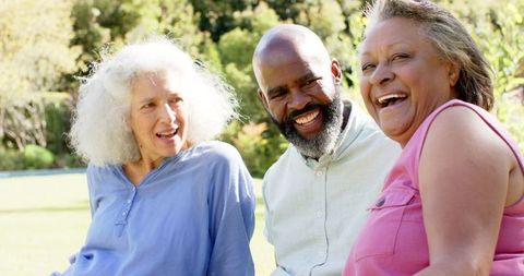Senior friends enjoying laughter outdoors