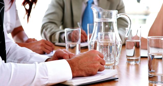 Close-Up of Business Meeting with People Taking Notes - Download Free Stock Images Pikwizard.com