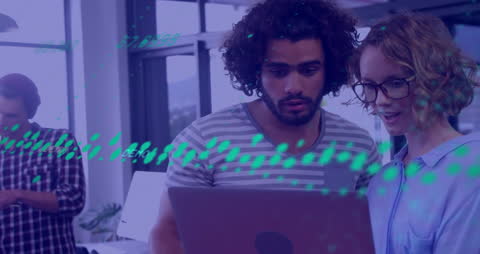 Multiracial Team Analyzing digital financial data in office