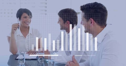 Team Collaborating on Financial Analysis in Office Meeting