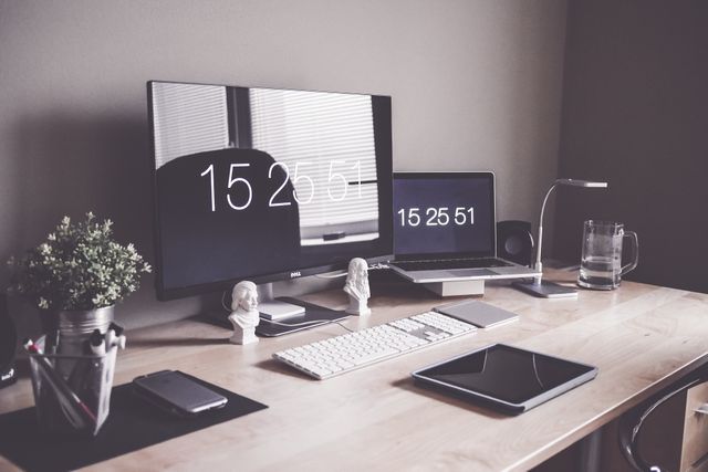 Minimalist Home Office Workspace with Clock Display on Screens - Download Free Stock Photos Pikwizard.com