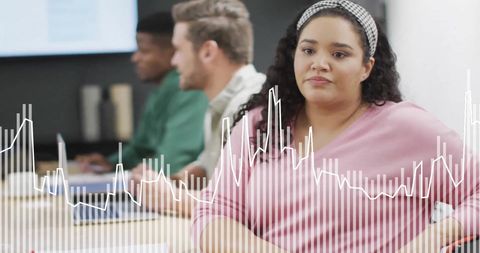 Diverse Team Processing Data in Modern Office Meeting