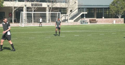 Soccer Players Practicing on Sunny Day