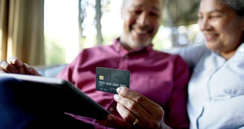 Senior Couple Online Shopping with Tablet and Credit Card
