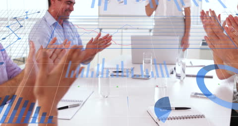 Successful Business Team Celebrating Financial Growth with Data Overlays