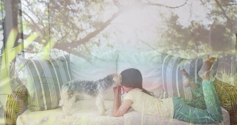 Girl Enjoying Cozy Moment with Dog on Couch Amidst Nature