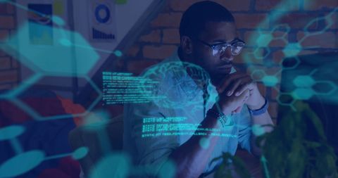 focused professional analyzing digital data with technology holograms - Download Free Stock Images Pikwizard.com
