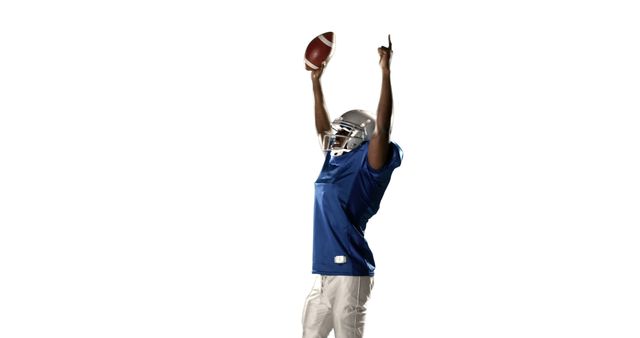 This image shows a football player wearing a blue jersey and helmet celebrating a touchdown with arms raised and a football in hand. It conveys feelings of victory, excitement, and accomplishment. This can be used for sports promotion, advertising athletic equipment, or illustrating the triumph and intensity of American football.