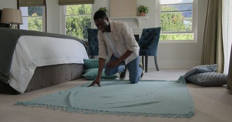 Groom Preparing Cozy Bedroom for Wedding Day