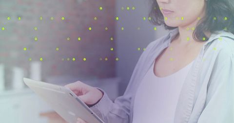 Asian Woman Using Tablet in Modern Kitchen