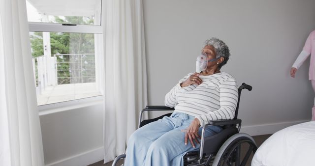 Elderly Woman in Wheelchair with Oxygen Mask Looking Out Window - Download Free Stock Images Pikwizard.com