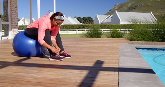 Woman Tying Sneakers While Exercising Near Swimming Pool - Download Free Stock Images Pikwizard.com