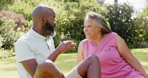 Smiling Senior Friends Enjoying Conversation in Sunny Park - Download Free Stock Images Pikwizard.com