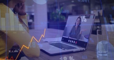 Team watching remote video meeting on laptop with financial charts and analytics overlay