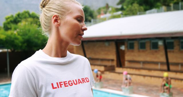 Female lifeguard overseeing swimming pool area - Download Free Stock Images Pikwizard.com