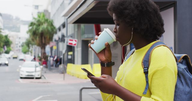 Young Woman Drinking Coffee and Using Smartphone in Urban Street - Download Free Stock Images Pikwizard.com