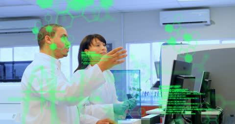 Innovative Scientists Analyzing Research Data in Modern Laboratory