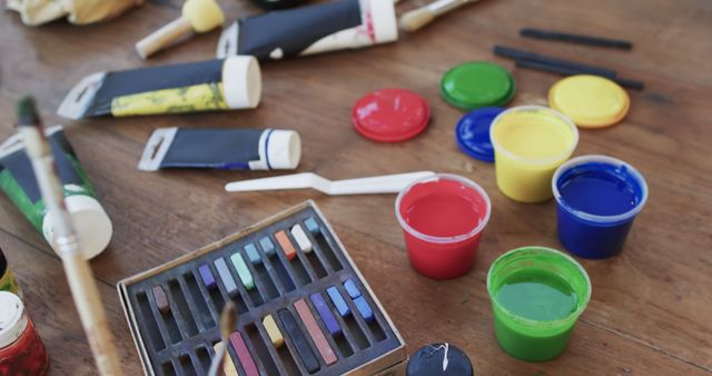 Close-Up of Art Supplies on Wooden Table Ready for Creative Painting - Download Free Stock Images Pikwizard.com