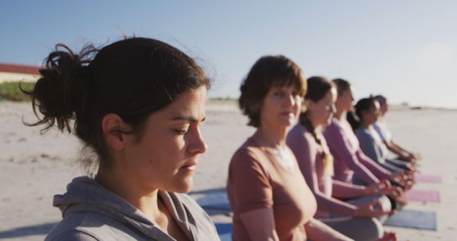 Women Meditating on Beach During Sunrise - Download Free Stock Images Pikwizard.com