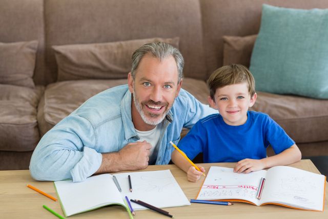 Father Helping Son with Homework in Living Room - Download Free Stock Photos Pikwizard.com
