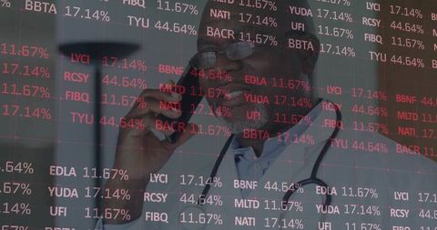 Doctor Engaging with Stock Market Data in Tech-Driven Environment