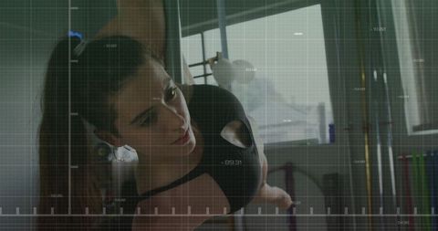 Woman Pole Dancing in Modern Studio Environment