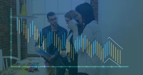 Coworkers collaborating with data overlay reviewing notes at modern brick office