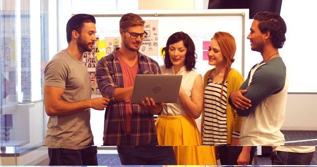 Young Diverse Team Collaborating on Laptop in Modern Office - Download Free Stock Images Pikwizard.com