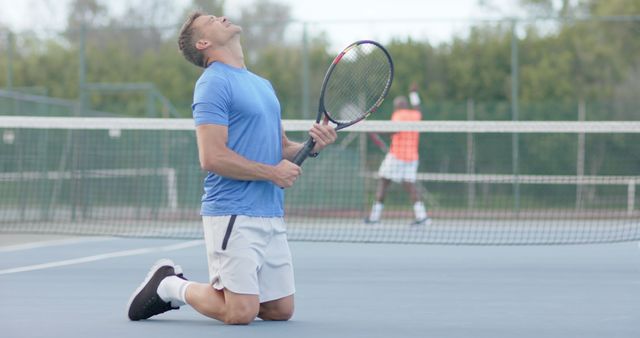 Joyful Tennis Player Celebrating on Court - Download Free Stock Images Pikwizard.com