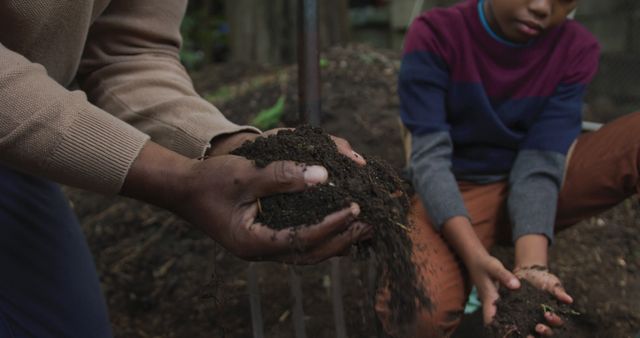 Parent and Child Gardening Together Handling Soil in Urban Garden - Download Free Stock Images Pikwizard.com