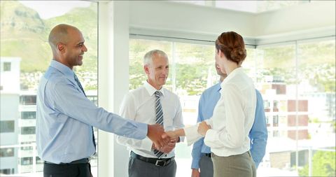 Business Professionals Celebrating Successful Agreement with Handshake - Download Free Stock Images Pikwizard.com